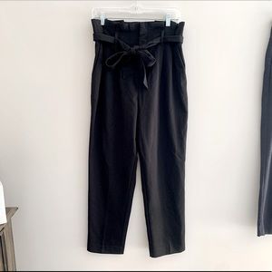 Cute black pants with bow and ruffle at top!